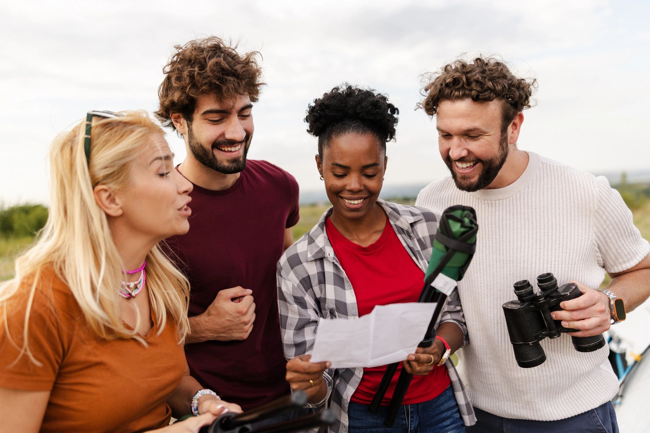 Travelers reviewing a map together outdoors